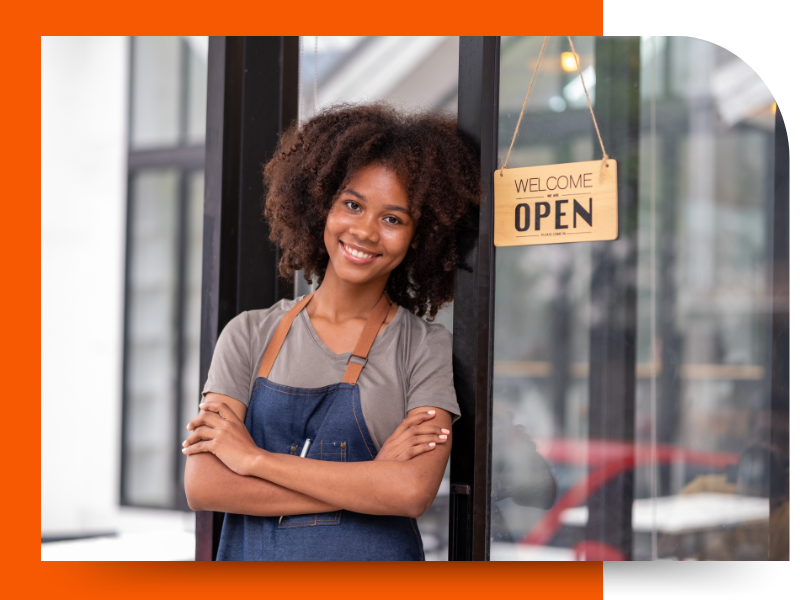woman standing beside an open sign